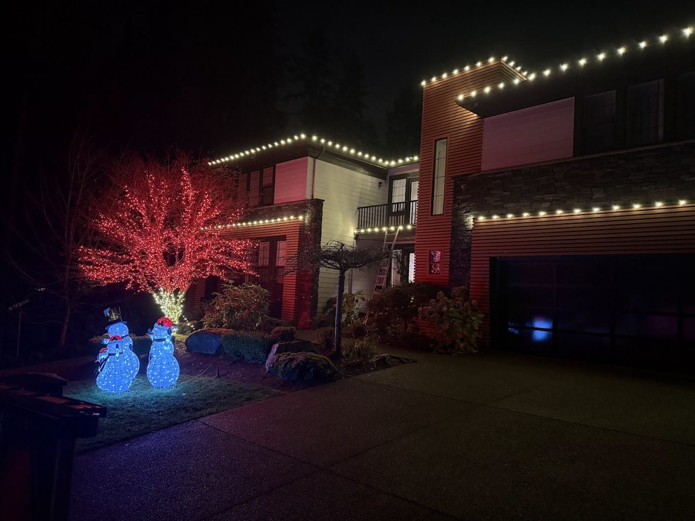Red tree wrap with snowmen decorations